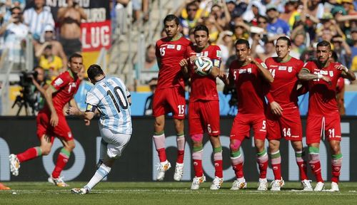Argentina's Messi takes a freekick against Iran during their 2014 World Cup Group F soccer match at the Mineirao stadium in Belo Horizonte